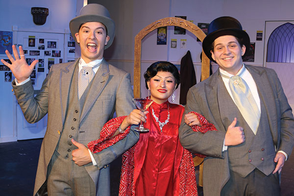 TRISHA MURPHY/Palatka Daily News – Senior Matthew Snider, left, gives a playful wave during rehearsal with castmates Gabrielle Chapman, center, and Andrew McClellan, right, as they prepare for their final bow with the Palatka Junior-Senior High School Musical Theater Department this weekend. 