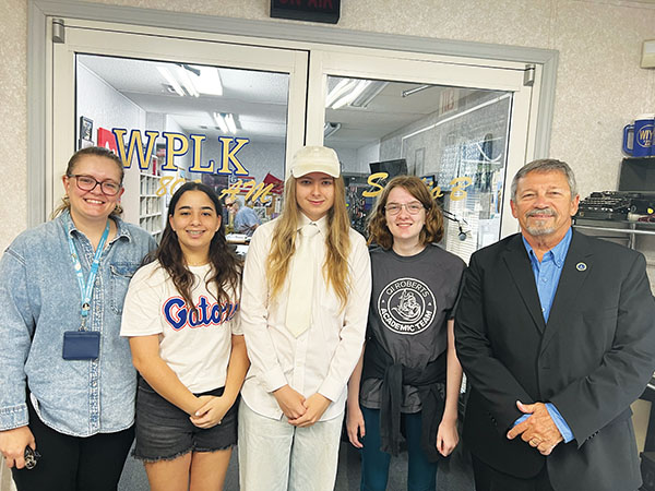 Photo submitted by Rick Surrency – Catelyn Boze, Leah Zabad, Gavin Miles, Audrey Redman and Superintendent Rick Surrency visit Bass Capital Radio on Wednesday to talk about the students’ fourth-place ranking at the recent Florida Commissioner’s Academic Challenge.