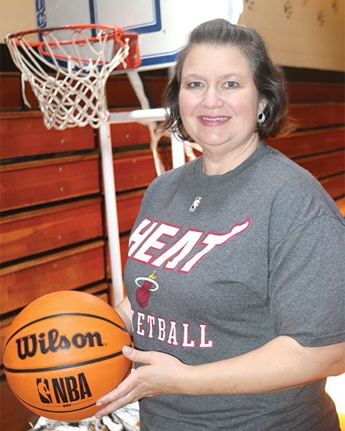 TRISHA MURPHY/Palatka Daily News -- Wendy Hansford, a college success coach with Take Stock in Children in Putnam County, stands inside the Fred P. Green Gymnasium in Palatka, where the Hoops for Hope Basketball Challenge will happen Saturday.