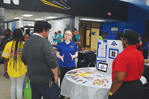 BRANDON D. OLIVER/Palatka Daily News – Karla Flagg, right, vice president of Karl N. Flagg Serenity Memorial Chapel, provides information about the business during Tuesday’s event.