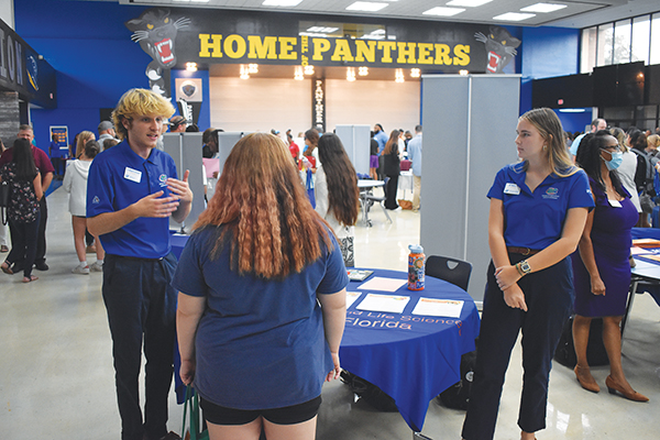 BRANDON D. OLIVER/Palatka Daily News – A Putnam County School District student talks to two University of Florida recruiters during Tuesday’s event at Palatka High.