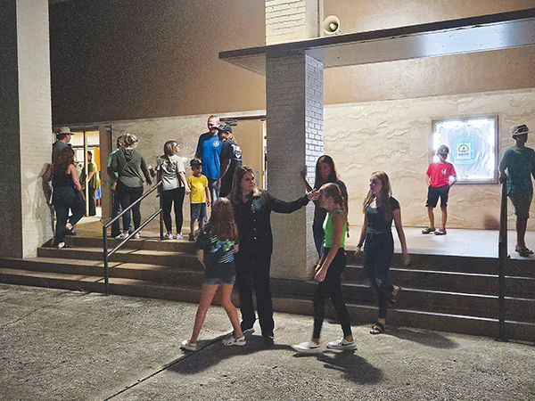 BRANDON D. OLIVER/Palatka Daily News – People mingle outside the C.L. Overturf Jr. District Center on Thursday evening after the vigil for Baylee Holbrook ended.