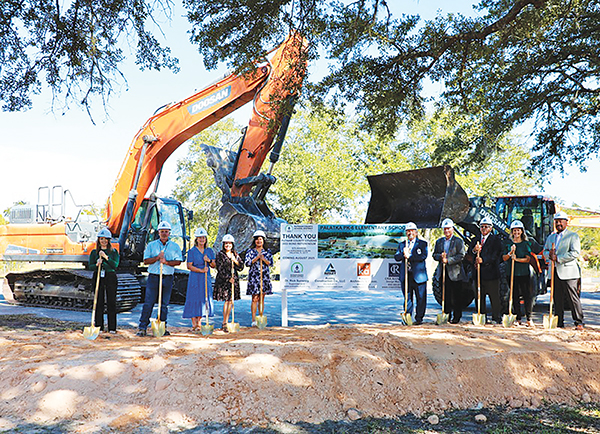 Photo courtesy of the Putnam County School District – School district employees and elected officials prepare to break ground at the site of a new elementary school in Palatka.