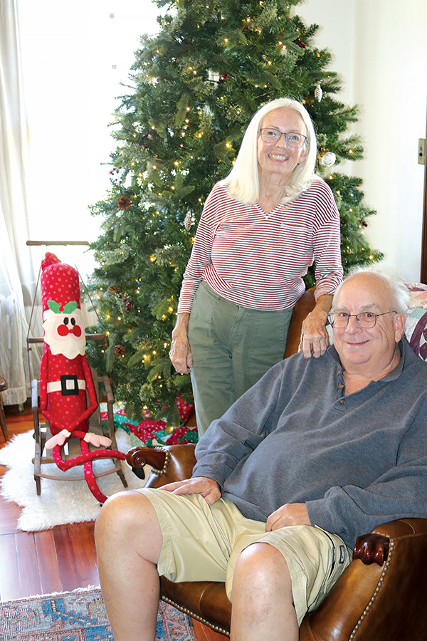 TRISHA MURPHY/Palatka Daily News – Beverly Genader, left, and her husband, Bob Morgan, relax in front of their Christmas tree in their 107-year-old home, which will be part of Saturday’s 2023 Christmas Tour of Homes.