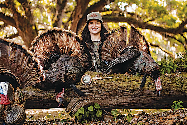 Submitted photo – Baylee Holbrook, an avid hunter, is pictured with turkeys after a previous hunt.