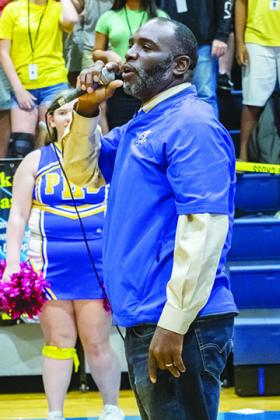 The head football coach, Willie Fells, speaks during the PHS homecoming pep rally