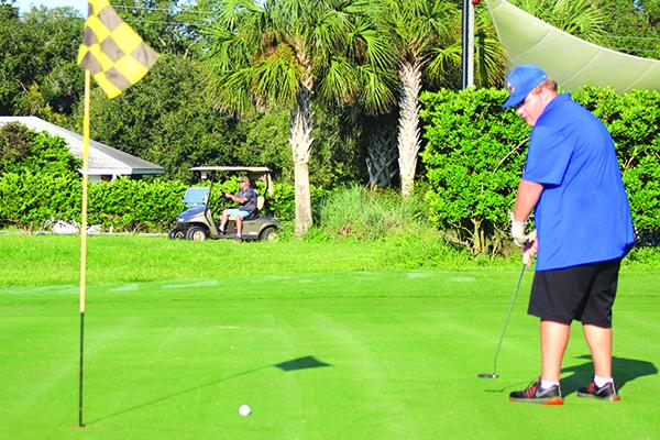 Palatka’s Reese Symonds watches his putt on the 18th green come up short of the hole. (MARK BLUMENTHAL / Palatka Daily News)