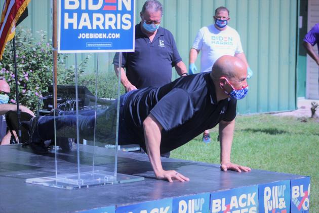 Sen. Cory Booker does pushups after former Sen. Bill Nelson told a story about the two having a pushup contest.