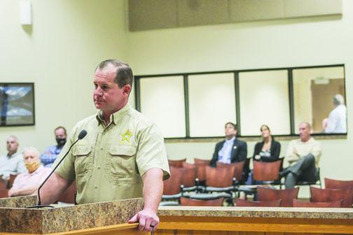 Sheriff Gator DeLoach listens to the Board of County Commissioners on Tuesday during a conversation about local internet cafés.