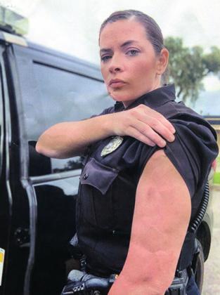 Crescent City Police Department officer Ashley Moczul shows a bruise on her arm she alleges she received after former police Chief Mark Carman grabbed her while both were on duty.