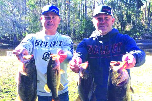 Lee Stalvey, left, and Jason Caldwell show off their winning catches during Saturday’s opening Xtreme Trails event. (Contributed)