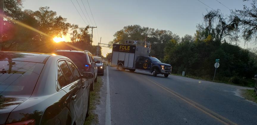 A Florida Department of Law Enforcement truck leaves the scene Saturday where human remains were found near Crescent City. (Wayne Smith/Palatka Daily News)