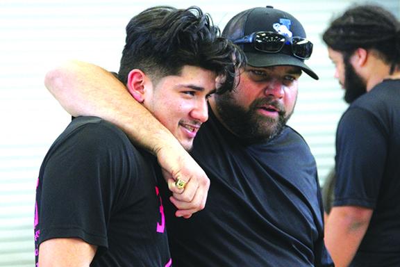 Interlachen coach Tad DeLoach puts his arm around Interlachen’s Jonathan Servin after he took second at 199 pounds, a weight class the Rams swept the top four spots. (ANTHONY RICHARDS / Palatka Daily News)