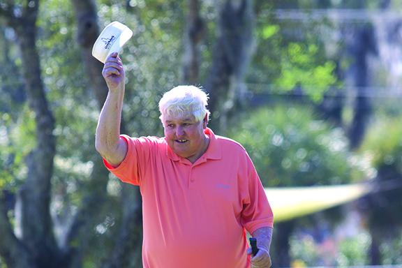 Former winner Ronnie Tumlin of Crescent Beach tips his hat after making a long putt on the fifth hole. (ANTHONY RICHARDS / Palatka Daily News)