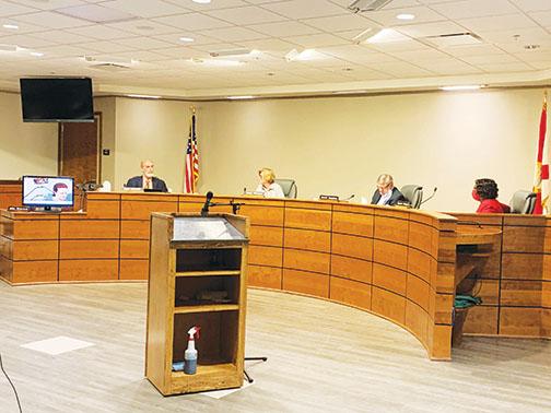 Putnam County School District board members discuss class-action lawsuits against vaping and opioid manufacturers at Tuesday’s board meeting.