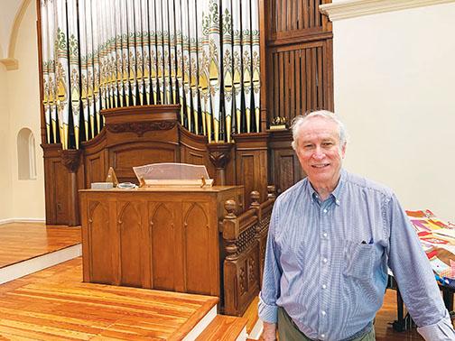 First Presbyterian Church Pastor Cliff Lyda stands Wednesday afternoon inside the revamped sanctuary, where the church’s organ, among other features and fixtures, has been refurbished.