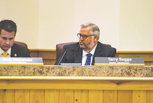 County Administrator Terry Suggs, right, listens to county commissioners during a meeting Tuesday morning.