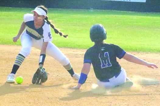 Peniel Baptist Academy’s Paige Bryan steals second base in the first inning as University Christian shortstop Erin Hutchens takes the late throw. (ANTHONY RICHARDS / Palatka Daily News)