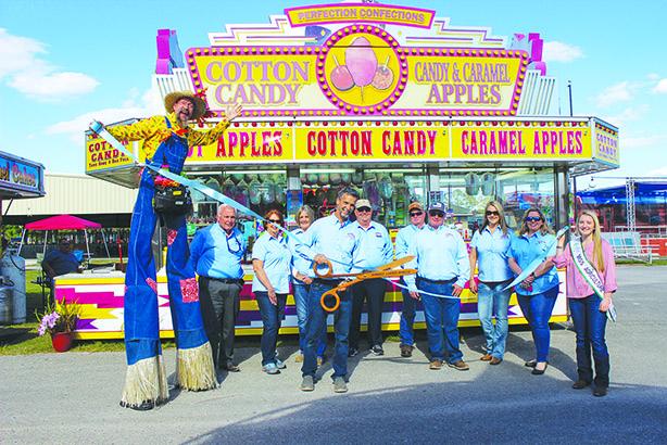 Putnam County Fair Authority President J.R. Newbold III cuts the ribbon to open the Putnam County Fair.
