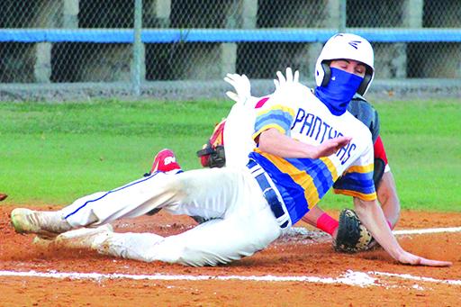 Palatka’s Trace Ogle crosses home plate ahead of the tag of Pierson Taylor High catcher Federico Rubio on a first-inning passed ball. (ANTHONY RICHARDS / Palatka Daily News)