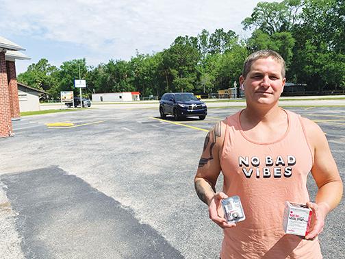 Nehemiah Project Director and Life Church Pastor Jeremy Rea holds a pack of Narcan nasal spray in the Life Church parking lot Wednesday afternoon.