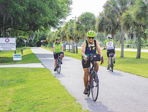 Cyclists travel along the Palatka-to-Lake Butler State Trial Saturday as part of Celebrate Putnam Trails.