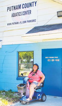 Palatka resident Sharon Proctor smiles outside the Putnam Aquatics Center in Palatka on Wednesday after going for a swim in the pool on its third day open.