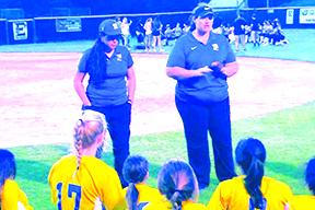 Palatka High School softball coach Brandi Malandrucco (left) listens as assistant coach Mindi Buckles talks to the team after Palatka lost to Eustis, 1-0, in the FHSAA Region 2-5A tournament in 2019. (MARK BLUMENTHAL / Palatka Daily News)