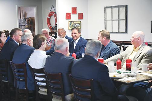 City Manager Don Holmes, bottom right, is among local government and business leaders who had breakfast with Gov. Ron DeSantis on Monday.