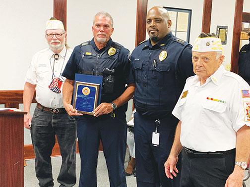 Palatka Police Department Lt. Scott Mast, second from left, was named Officer of the Year. Veterans of Foreign Wars Post 3349 Quartermaster Gerald Shuler, left, and Commander Gerald Donnelly, right, presented the award while Police Chief Jason Shaw accompanied Mast.