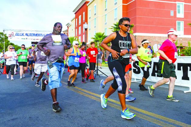 Runners take off from the start of the 2019 Beck 5K run in downtown Palatka. (Daily News file photo)