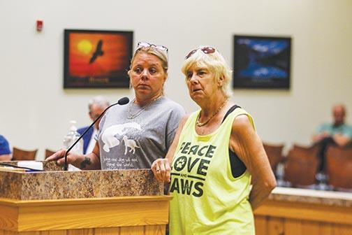 Carol Mussoline and S.A.F.E. Manager Tina Harsey listen to the Putnam County Board of Commissioners during a debate about a zoning change for the animal group.