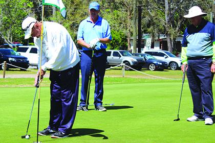 Golfers compete on the ninth hole at Palatka Muncipal Golf Club in March’s Azalea Tournament. (MARK BLUMENTHAL / Palatka Daily News)