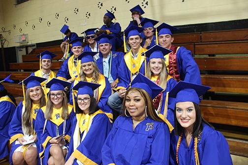 Some of Palatka High School’s class of 2021 graduates smile as they wait for the ceremony to get underway Friday night.