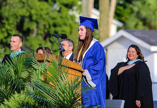 Q.I. Roberts Junior-Senior High School student Amelia Sloan sings the Star Spangled Banner during Saturday’s graduation ceremony in Palatka. 