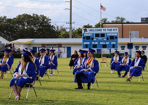 Q.I. Roberts Junior-Senior High School students prepare to graduate Saturday night as they listen to class speakers reflect on their high school years.