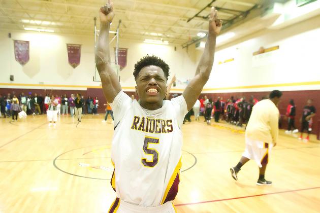 Kenton Bibbs is jubilant after Crescent City beat Williston for the Region 4-1A title on Feb. 20, 2015. (Daily News file photo)