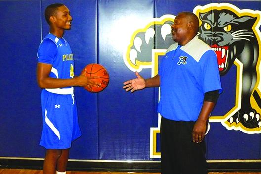 The 2017-18 Palatka High School boys basketball team had a steadying force at point guard in senior Chamar Dumas (left) and was coached by second-year mentor Bryant Oxendine. (MARK BLUMENTHAL / Palatka Daily News)
