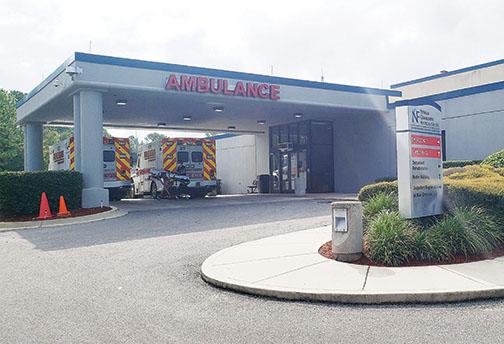 Ambulances wait outside the emergency room at Putnam Community Medical Center on Friday morning.