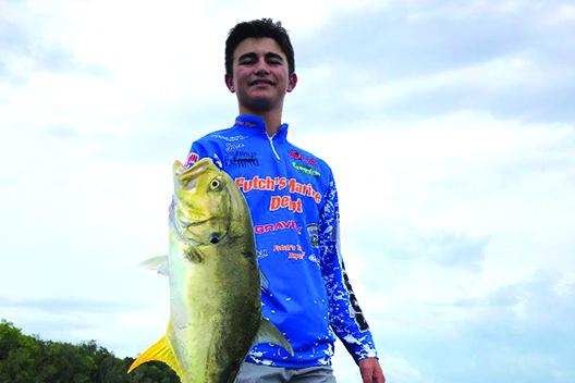 Jace Akers of Palatka shows off his Jack Cravelle before releasing  it back into the St. Johns River. They were fishing the B.A.S.S. Nation Jr./Sr. High School Bass Tournament Series earlier this month. (GREG WALKER / Daily News correspondent)