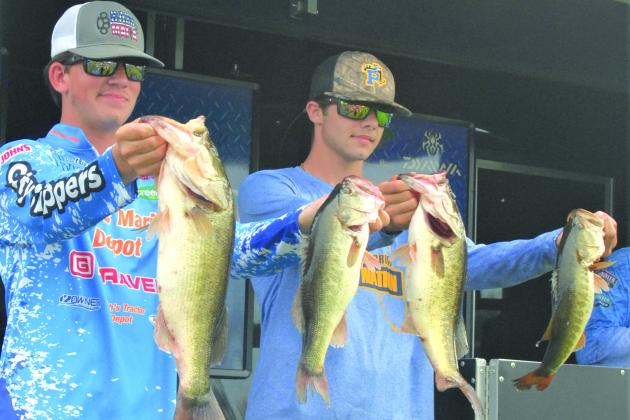Palatka’s Syler Prince and Austin Peters hold up their fish for their runners-up place. (GREG WALKER / Daily News correspondent)