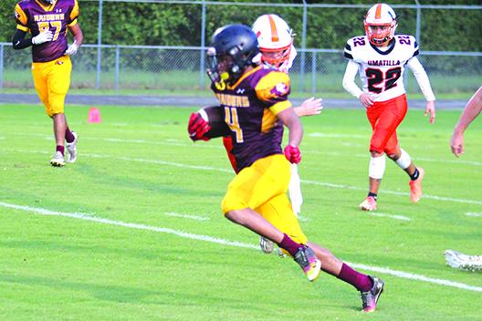 Sheldon Patrick returns an interception 69 yards for a Crescent City touchdown last Frday night against Umatilla. The Raiders travel to Interlachen to face the Rams this Friday night. (MARK BLUMENTHAL / Palatka Daily News)
