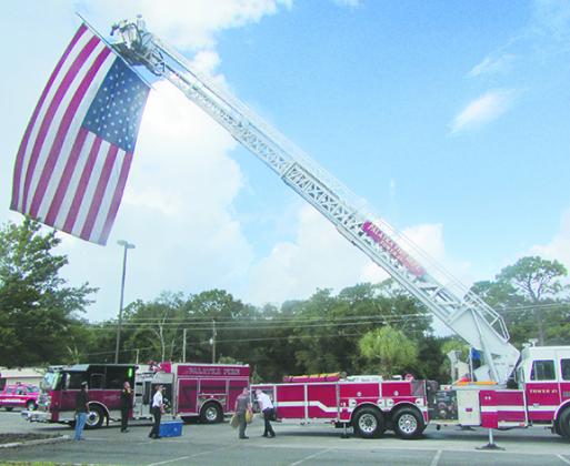 A giant American flag flies from a Palatka ladder truck prior to last year’s 9/11 Remembrance Ceremony at the Putnam County Government Complex.