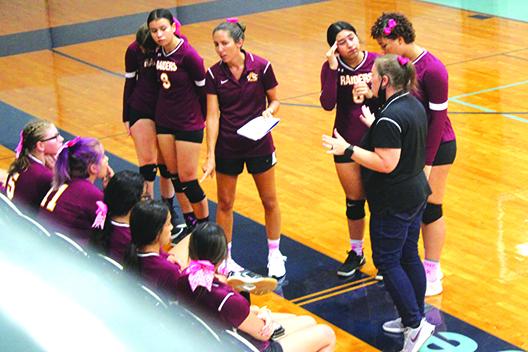 Crescent City volleyball coach Ashley Jones (center) talks to her team during a timeout in her team’s loss to Peniel Baptist Academy last Thursday. (MARK BLUMENTHAL / Palatka Daily News)