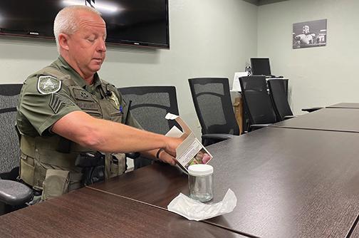 Putnam County Sheriff’s Office Sgt. Emmett Merritt pulls out the contents of a scent evidence kit that can be requested from the sheriff’s office.