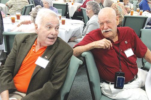  Andrew Efstathion, left, a member of the class of 1953, shares a laugh with one of the reunion guest speakers, Dickie Ryals, who is a member of the class of 1956.