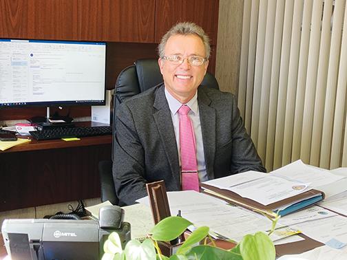 Recently appointed City Manager Charles Rudd sits in his office at City Hall in Crescent City.