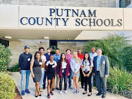 Putnam County School District high school students smile for a picture with school Superintendent Rick Surrency as part of a Student Advisory Council meeting Tuesday morning.