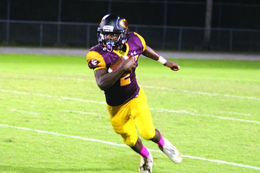 Crescent City quarterback Naykeem Scott threw for 226 yards and ran for 179 in his team’s 62-38 win over the Wolfpack. (MARK BLUMENTHAL / Palatka Daily News) 