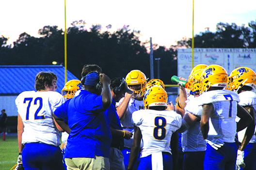 Palatka Junior-Senior High School coaches talk to players during a timeout during last Friday night’s loss to Clay. (COREY DAVIS / Palatka Daily News)